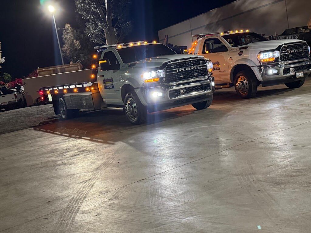 Graham's Towing trucks staged at the La Habra yard at night